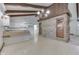 Spacious kitchen with bar top, white cabinetry, and stone accent wall at 6637 E County Road 600 S, Plainfield, IN 46168