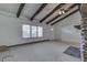 Bright and airy living room boasts beamed ceilings, neutral carpeting, and a large window with a view at 6637 E County Road 600 S, Plainfield, IN 46168