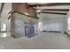 Spacious living room with beamed ceilings, stone fireplace, and neutral carpeting awaiting your personal touches at 6637 E County Road 600 S, Plainfield, IN 46168