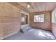 Charming porch with wood paneling and slider doors leading to the outside at 6637 E County Road 600 S, Plainfield, IN 46168