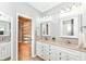 Bathroom with dual sinks and a large closet at 6656 Easy St, Fishers, IN 46038