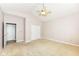 Bedroom features a ceiling fan, carpeted floor, and a closet for ample storage at 6656 Easy St, Fishers, IN 46038