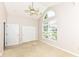 Bedroom featuring a ceiling fan, large window, and ample closet space at 6656 Easy St, Fishers, IN 46038