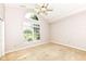 Spacious bedroom with a vaulted ceiling and a large window at 6656 Easy St, Fishers, IN 46038