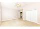 Bedroom features a ceiling fan, carpeted floor, and a closet for ample storage at 6656 Easy St, Fishers, IN 46038