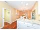 Bright dining area features stylish chandelier, wood table, seating for six and opens to the kitchen at 6656 Easy St, Fishers, IN 46038