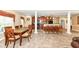 Dining room showcasing wood dining table and upholstered chairs with a view of the kitchen area at 6656 Easy St, Fishers, IN 46038