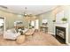 Spacious living room with a fireplace, plush carpet, and neutral decor at 6656 Easy St, Fishers, IN 46038