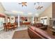 Open-concept living area that flows into the kitchen with seating, a dining area, and stylish furnishings at 6656 Easy St, Fishers, IN 46038