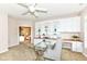 Bright office features custom built-ins, desk, and a ceiling fan at 6656 Easy St, Fishers, IN 46038
