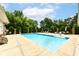 Outdoor pool surrounded by lounge chairs and greenery, ideal for relaxing and entertaining at 6656 Easy St, Fishers, IN 46038