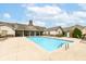 Resort-style pool with lounge chairs and covered seating area offers an outdoor oasis for relaxation and entertainment at 6656 Easy St, Fishers, IN 46038