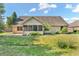 Well manicured backyard with brick home and screened in porch at 6686 Woodcrest Dr, Avon, IN 46123