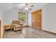 Comfortable bedroom features a recliner, side table, and closet with sliding doors at 6686 Woodcrest Dr, Avon, IN 46123