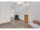 Spacious bedroom with neutral paint, hardwood flooring, and comfortable seating at 6686 Woodcrest Dr, Avon, IN 46123