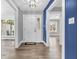 Bright foyer with hardwood floors, showcasing a contemporary entrance and a stylish interior design at 6686 Woodcrest Dr, Avon, IN 46123