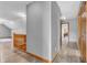 Upstairs hallway with wood laminate flooring and neutral paint at 6686 Woodcrest Dr, Avon, IN 46123