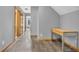 Hallway with wood laminate flooring, neutral walls, and natural light at 6686 Woodcrest Dr, Avon, IN 46123
