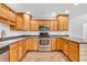 Well-equipped kitchen featuring stainless steel appliances and ample cabinet space at 6686 Woodcrest Dr, Avon, IN 46123