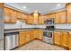 Well-lit kitchen featuring stainless steel appliances and light wood cabinetry at 6686 Woodcrest Dr, Avon, IN 46123