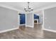 Stylish living room showcasing hardwood floors, modern lighting, and an inviting open-concept design at 6686 Woodcrest Dr, Avon, IN 46123