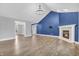 Bright living room with a fireplace, a vaulted ceiling, and a chandelier at 6686 Woodcrest Dr, Avon, IN 46123