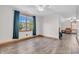Finished attic room with vinyl wood flooring, ample natural light, and comfortable seating at 6686 Woodcrest Dr, Avon, IN 46123
