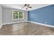 Large bedroom with a large window and neutral colors at 6686 Woodcrest Dr, Avon, IN 46123