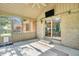 Relaxing screened in porch with ceiling fan at 6686 Woodcrest Dr, Avon, IN 46123