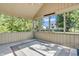 Screened porch with open windows overlooking backyard and wooded fence at 6686 Woodcrest Dr, Avon, IN 46123