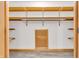 Organized walk-in closet with built in shelving at 6686 Woodcrest Dr, Avon, IN 46123