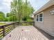 Spacious wooden deck perfect for outdoor relaxation and entertaining, with view of backyard at 7645 Inverness Dr, Indianapolis, IN 46237