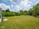 Expansive green backyard showcasing the property's outdoor space and lush surroundings at 7645 Inverness Dr, Indianapolis, IN 46237