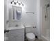 Bathroom with vanity, toilet, and shower stall, all in clean, white finishes at 7645 Inverness Dr, Indianapolis, IN 46237