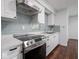 Updated kitchen features stainless steel oven and range with matching white cabinetry at 7645 Inverness Dr, Indianapolis, IN 46237