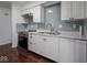 Well-equipped kitchen featuring stainless steel oven and dishwasher and ample cabinet space at 7645 Inverness Dr, Indianapolis, IN 46237