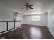 Open-concept living area with hardwood floors, and modern lighting with easy access to other living spaces at 7645 Inverness Dr, Indianapolis, IN 46237