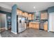 Modern kitchen featuring stainless steel appliances, ample maple cabinetry, and a bright atmosphere at 77 Winding Brook Way, Pendleton, IN 46064