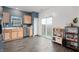 Well-lit kitchen featuring stainless steel appliances, wood cabinets, and a sliding glass door to the backyard at 77 Winding Brook Way, Pendleton, IN 46064