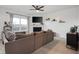 Bright living room showcases a comfortable sectional sofa, fireplace, TV, and stylish decor at 77 Winding Brook Way, Pendleton, IN 46064