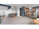 Open-concept living area featuring a dining space and hardwood leading to a modern kitchen at 77 Winding Brook Way, Pendleton, IN 46064