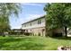 Exterior view of the home and backyard including patio and a large manicured lawn at 787 West St, Whiteland, IN 46184