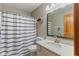 The full bathroom features a shower/tub with curtain, a single sink vanity, and an adjacent toilet at 787 West St, Whiteland, IN 46184