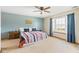 Bright bedroom featuring neutral walls, a large window, and a striped bedspread at 787 West St, Whiteland, IN 46184