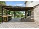 View of covered patio with decorative wood pergola, string lights and outdoor furniture at 787 West St, Whiteland, IN 46184