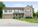 Charming two-story home with a brick and siding exterior, attached garage, and a welcoming front porch at 787 West St, Whiteland, IN 46184