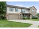 View of two-story home, large lawn, front porch, driveway, and attached two car garage at 787 West St, Whiteland, IN 46184