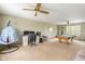 Large recreational room featuring a pool table, computer desks, and a comfortable hanging chair at 787 West St, Whiteland, IN 46184