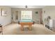 This bright game room features a well-maintained pool table, window views, and ample lighting for entertainment at 787 West St, Whiteland, IN 46184
