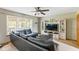 The comfortable living room features a large window, sectional couch, and modern entertainment center at 787 West St, Whiteland, IN 46184